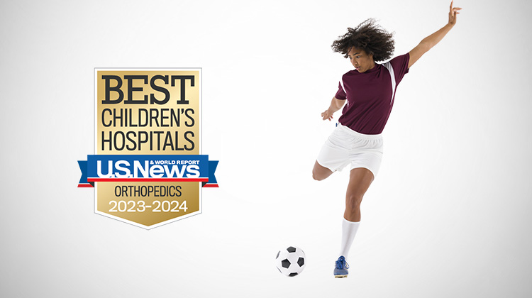 Teenage girl kicking a soccer ball. click to watch a video about our patient rosario.