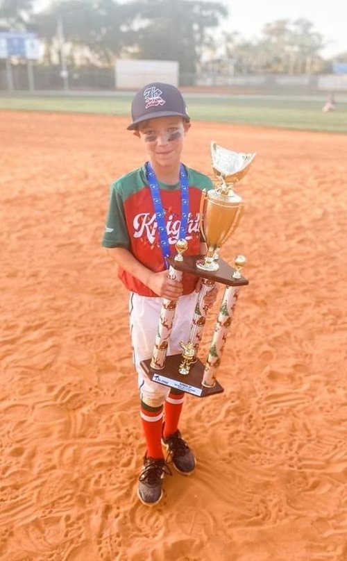 Krue with the World Series Youth Baseball trophy