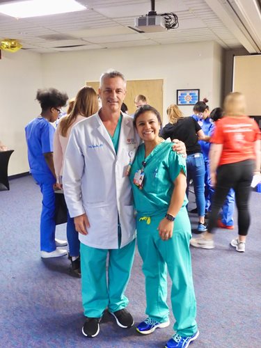Dr. Spurdle and Dr. Payares in their scrubs